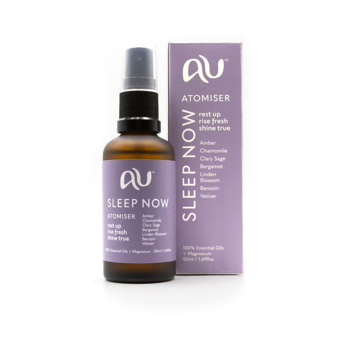 Abundance Unlimited Sleep Now Atomiser bottle is made of amber coloured glass and has a lilac and white label, it sits next to its lilac box, on a white background