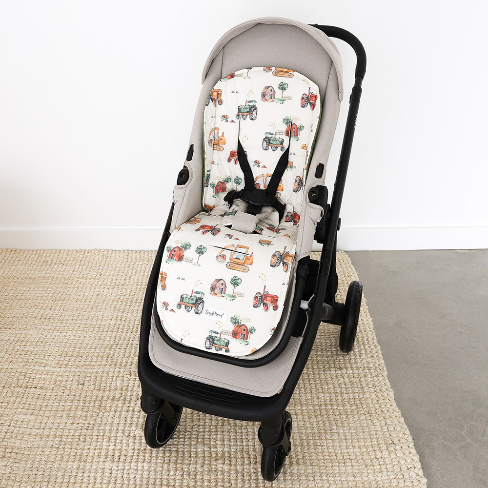 Diggers & Tractors pram liner fitted in a pram