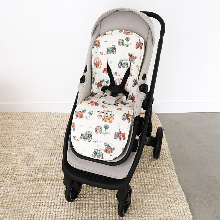 Diggers & Tractors pram liner fitted in a pram